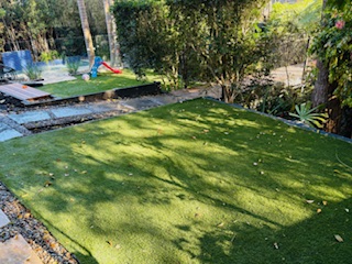 backyard-makeover turf paved-path timber-bench